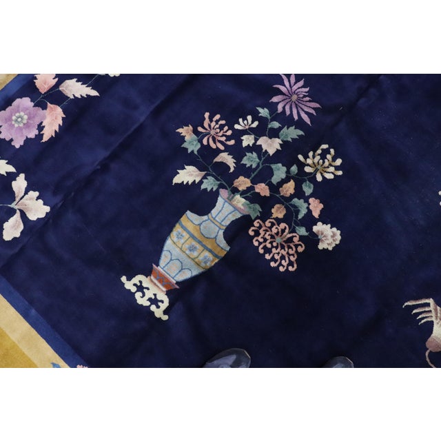 Beautiful large Chinese Art Deco rug with a floral design on a sna field and plum border. Room size formats are usually...