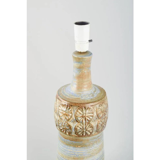 Arne Finne for Søholm. Huge ceramic lamp with period-typical pattern. Glaze in earth tones. Model number 3080. Circa 1970....