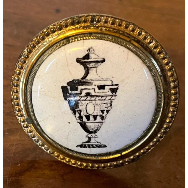 Antique 19th century Bilston / Battersea enamel mirror support or curtain tie back featuring an urn. May also be used as a...