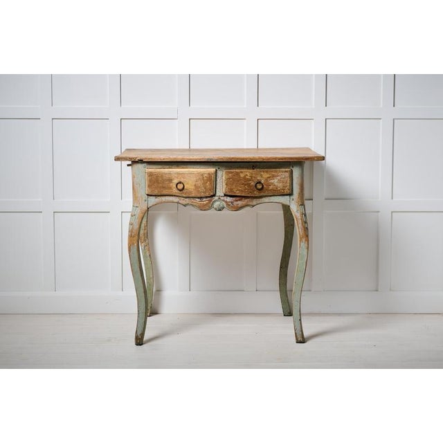 Rare antique side table from the rococo period around 1780. This Swedish antique is one-of-a-kind made by hand in northern...