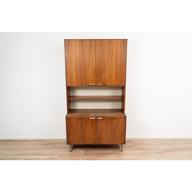 Wall cabinet by Cees Braakman for Pastoe. The cabinet comes with multiple storage compartments. with a combination of...