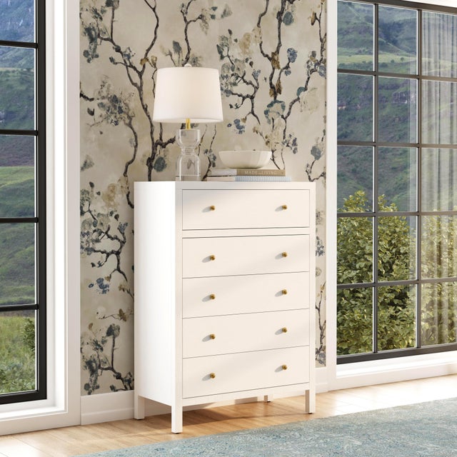 Elevate your space with the timeless charm and functional elegance of the Butler Specialty Company Nora 5 Drawer Tall...