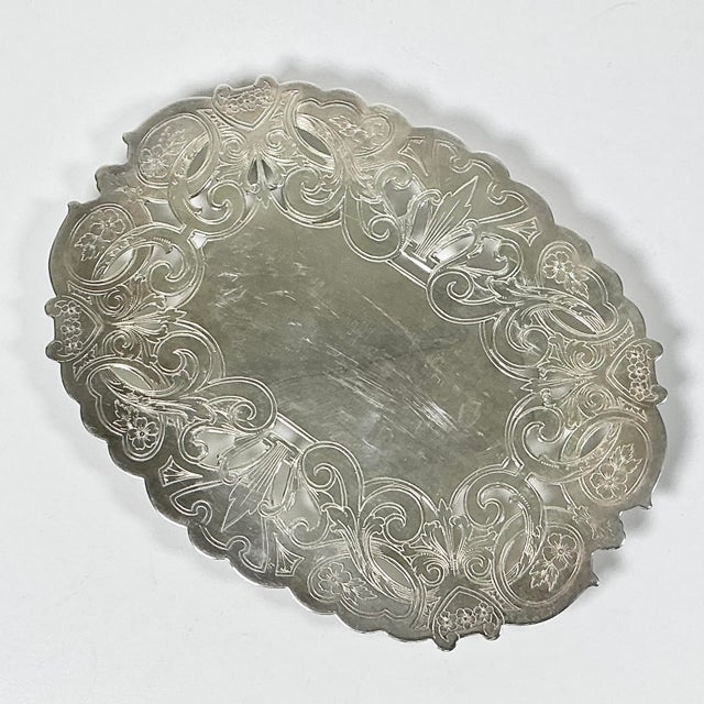A lovely Silverplate Trivet from Wallace Silver Co. It’s rather large and perfect for use on a dining table. It features...