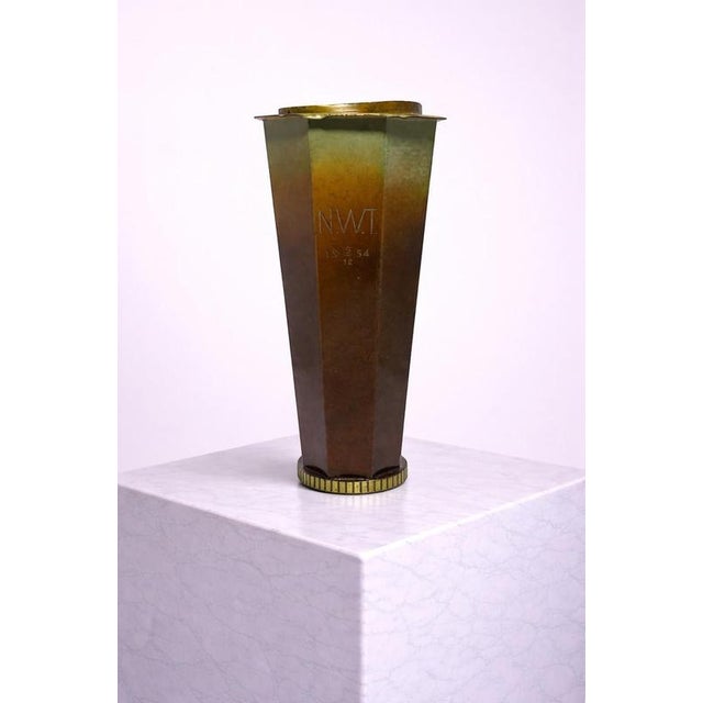 A refined and sculptural Swedish Art Deco bronze vase by Metallkonst, dating to the 1950s. This piece embodies the clarity...