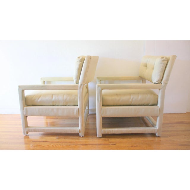 This is a pair of mid century modern Milo Baughman style Parsons chairs for John Stuart. They are fully upholstered in a...