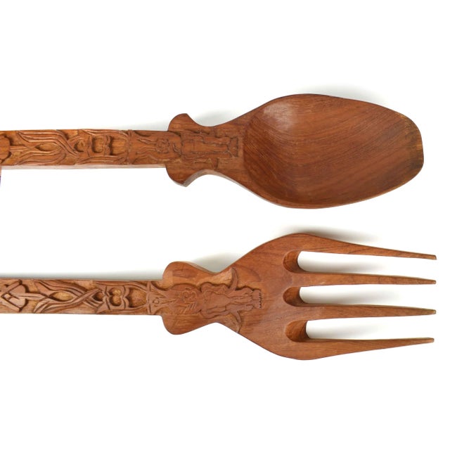 Stunning extra large hand carved solid wood wall hanging spoon and fork set. Each handle has filigree and elephant motif...