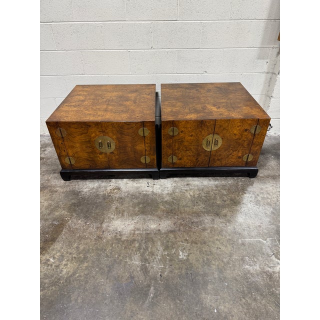 I do not know a maker name, which seems crazy given the quality of these spectacular burlwood nightstands. Great vintage...
