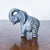 Primitive Hand Carved Good-Luck (Trunk-Up) Elephant of Veined Stone Elegant piece of hand-carved stone, primitive....