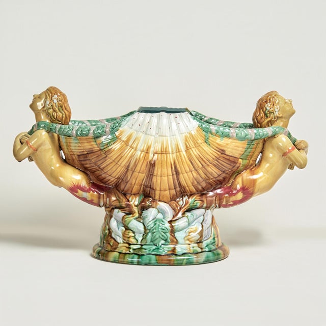 Whimsical 19th century Italian hand decorated glazed earthenware centerpiece crafted in a fantasy composition with...