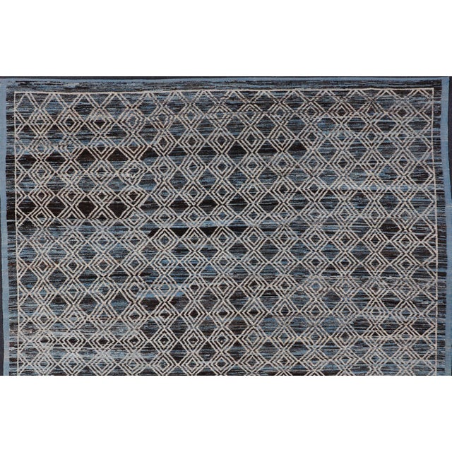 Modern and casual rug. Neutrals, charcoal, gray, blue and brown tribal Afghan Modern Rug Geometric design. Keivan Woven...