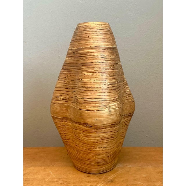 This vintage decorative vase is a striking example of mid-century organic design, celebrating the natural beauty of richly...