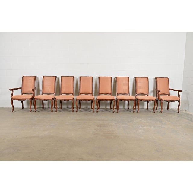 An outstanding set of eight French Rococo or French Provincial Louis XV style dining chairs By Baker Furniture USA, Circa...