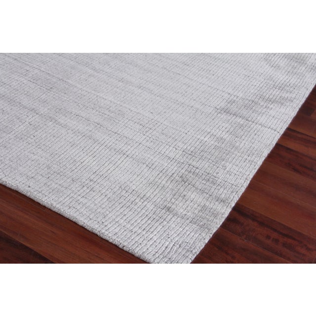 The perfect foundation to any room. The Hamm rug with its rich, saturated color and luxurious bamboo silk will complement...