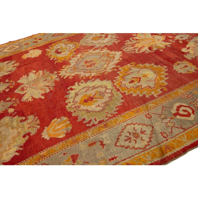 1900 - 1909 Turkish Oushak Antique Wool Rug Handmade in Red Featuring a Floral Design For Sale - Image 5 of 11