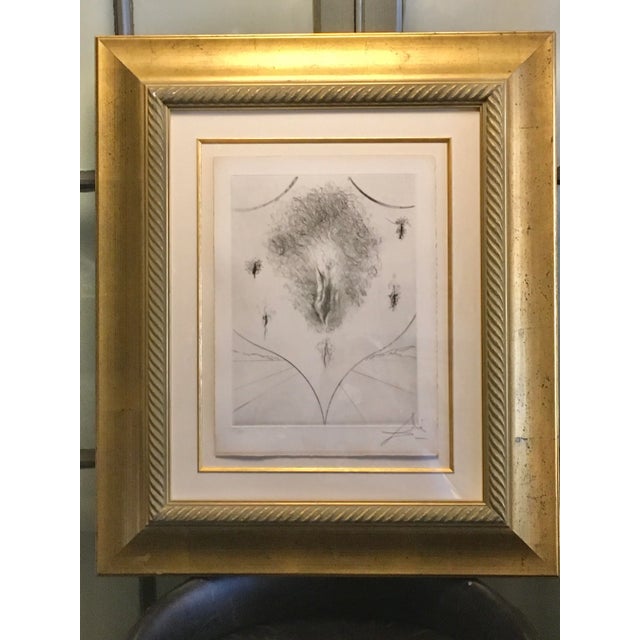 Blazon by Spanish Artist Salvator Dali. A Numbered 27 of 150 Hand Colored Etching. Artwork dimensions are 11”w x 15”h....