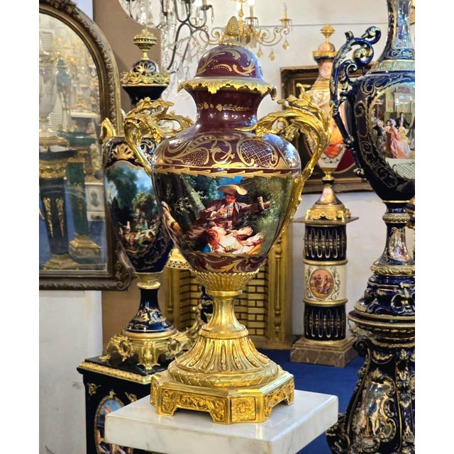 Add an unmistakable sense of European grandeur to your interior with this ornate French-style porcelain vase, featuring a...