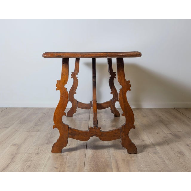 A distinguished example of 18th-century Italian craftsmanship, this Fratino table features a richly patinated solid walnut...