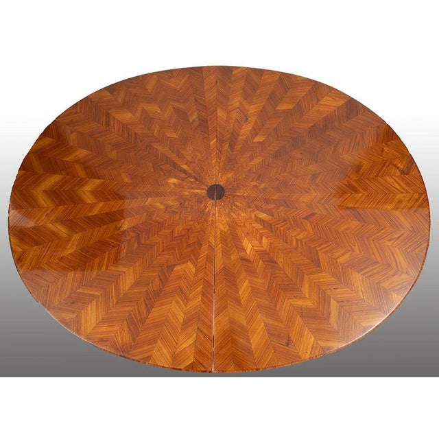 An extendable Napoleon III-style oval table made of fine exotic wood, dating from the second half of the 19th century. The...