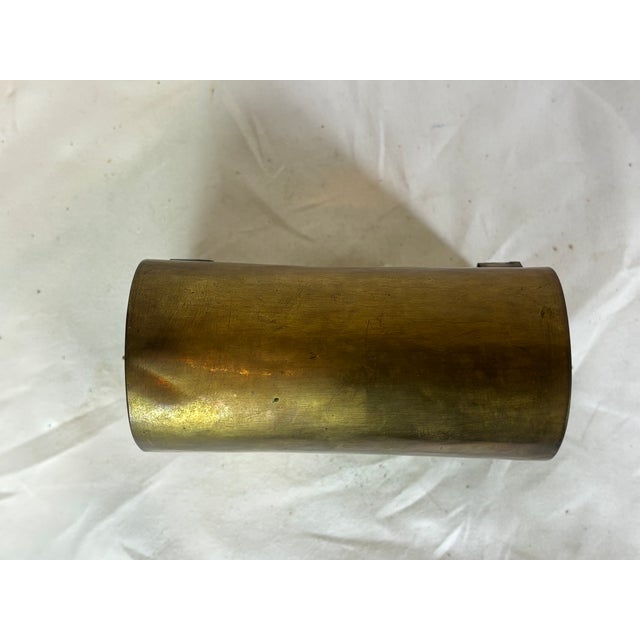 This handsome casket has s scrolls on the two ends each holding a brass ring. Has two brass hinges holding the top. The...