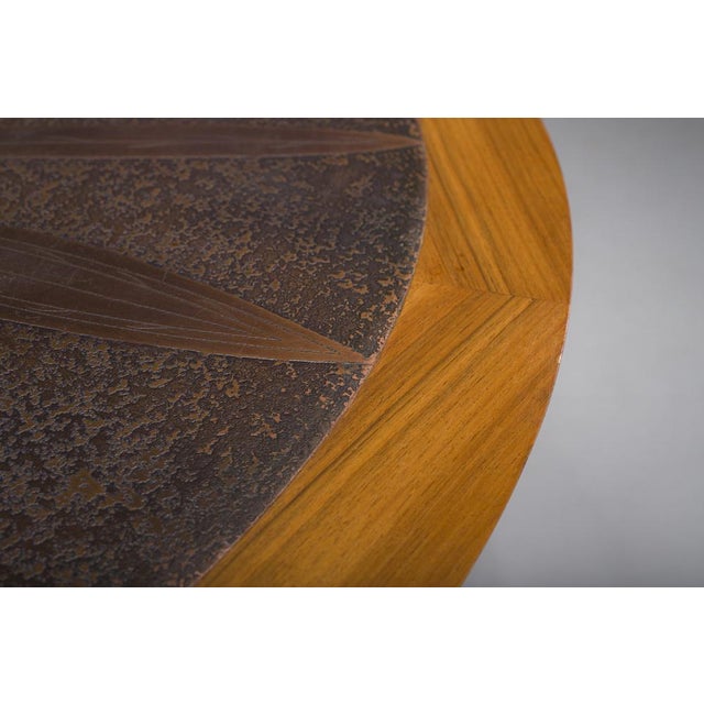 Sculptural round coffee table attributed to Heinz Lilienthal, Germany, 1970s. Featuring a solid wood pedestal base and a...