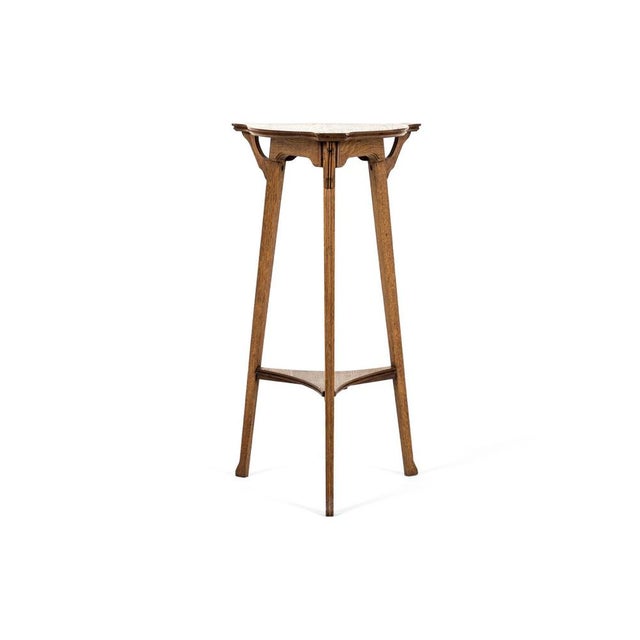 A rare vienna secession oak jardinière stand on slender tripod supports. The shapely top bears a moulded edge with a...