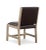 Cerused white oak dining chair with chocolate brown trapunto stitched leather seat back.