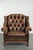 This vintage cowhide Chesterfield wing armchair is crafted in an English style and boasts a luxurious look. The armchair...