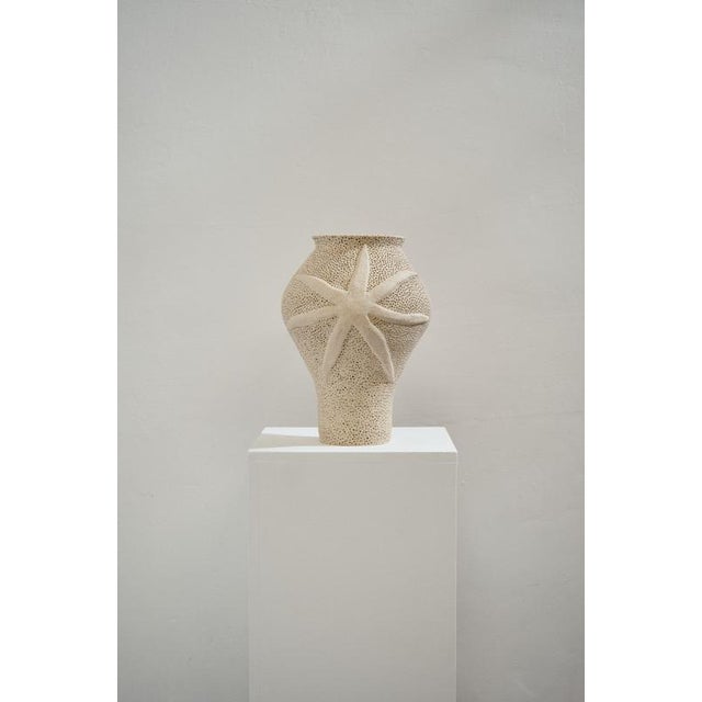 L´Étoile De Mer Beige Sandstone Vase by Lou Thomas Dimensions: ⌀ 24 x H 26 cm Materials: Beige sandstone "Drawing on her...