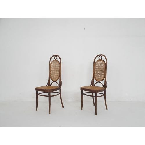 Set of two bentwood dining chairs with webbing seating and back, by Michael Thonet. Both in good original condition. This...