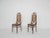 Set of two bentwood dining chairs with webbing seating and back, by Michael Thonet. Both in good original condition. This...