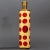 Enameled table lamp in white with red transfer printed lithographic cameos of emperors, and patinated brass. The...