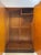A great example of English Art Deco cabinetry, this wardrobe features mesmerizing book-matched burl walnut doors with a...