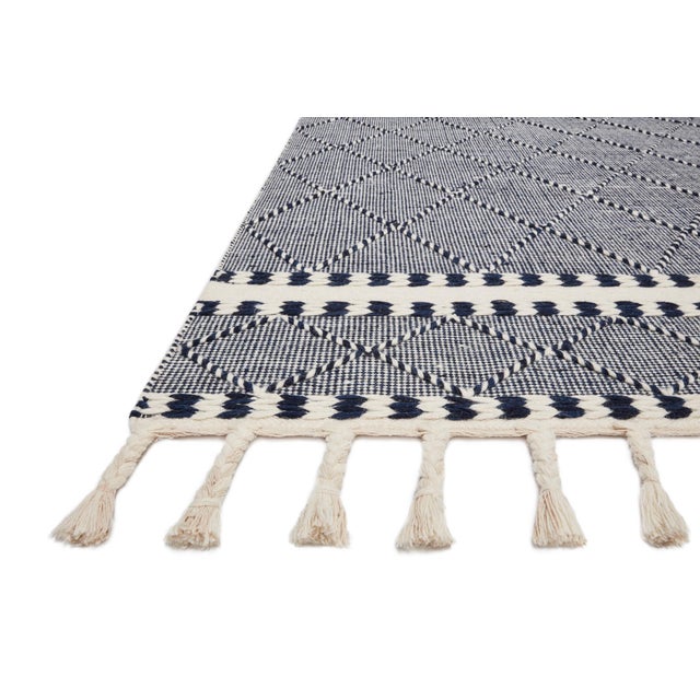 Hand-loomed of wool, cotton and other fibers in India, the Sawyer Collection features bold graphic designs. Textural,...