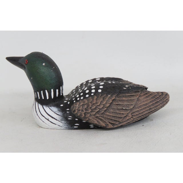This highly charming Loon Figurine is made of resin. This beautiful sculpture was handmade in Canada by Heritage Artists...