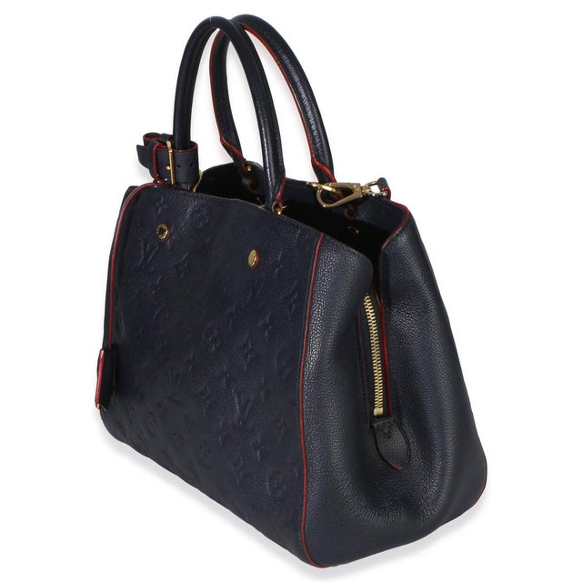 Item #: 153508 Exterior Material: Leather MSRP: 3,350 Interior Material: Fabric Size: MM Features Interior: Two gussets....