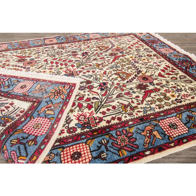 Beautiful Vintage Hamadan Handmade Wool Rug with an Ivory field. This rug has multi-color accents in an allover Botanical...