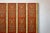 Wood Four-Panel Red Lacquer Folding Screen with Hand-Painted Floral Scrollwork For Sale - Image 7 of 12