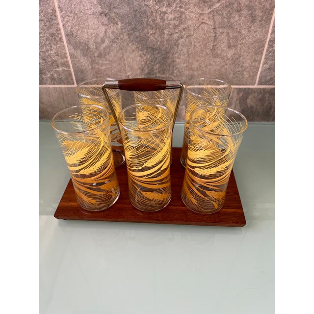 Vintage Libbey tumbler glasses from the 70’s! Set of 6 matching glasses in a custom wooden caddy. The bottoms of the...