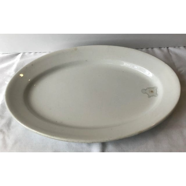 Antique ironstone platter marked “Royal Ironstone China Alfred Meakin England. The mark of this heavy platter indicates a...