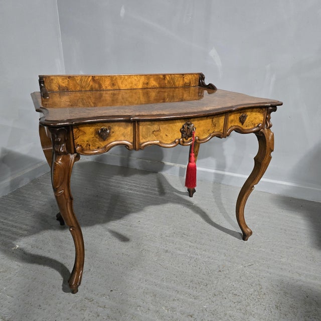 A very nice French burr walnut side table or dressing table with full width drawer and original lock, serpentine shaped...