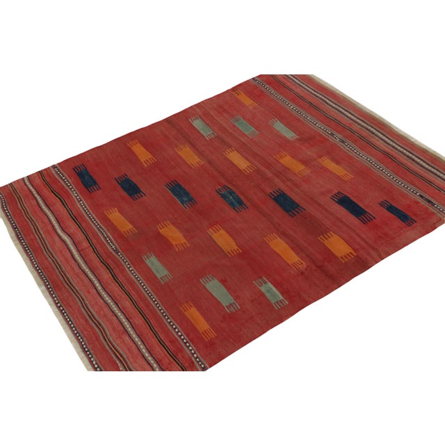 Connoting the celebrated tribal style, this 5x7 kilim rug hails from a special new curation of antique flat weaves. This...