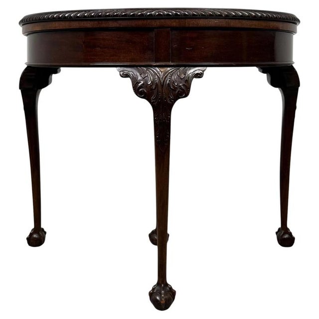 A beautifully crafted early 20th-century English Edwardian card table, finely constructed in mahogany and distinguished by...