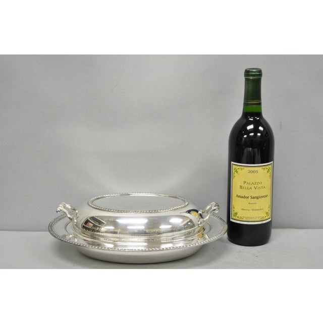 Vintage Modern Silver Mfg Co Silver Plated Twin Handle Vegetable Serving Dish. Circa Mid 20th Century. Measurements: 3" H...