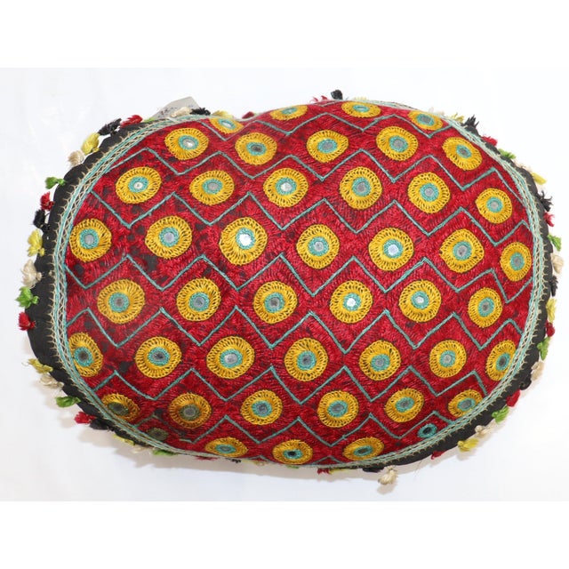 A pillow made with a Indian Textile Measures: 16'' x 18''.