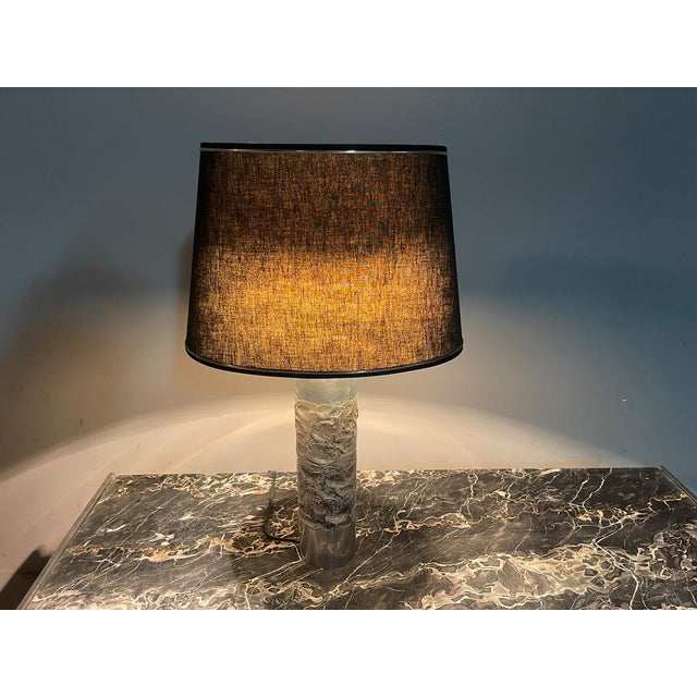 A striking Belgian Brutalist table lamp attributed to Willy Luyckx for Aluclair, dating from the 1960s–1970s. The lamp...