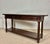 Elegant 1930s Spanish console table crafted in walnut with a warm rich patina. The piece features three drawers across the...