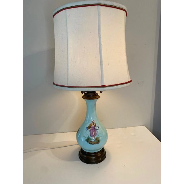 My grandmother had this 19th century oil lamp on brass base electrified to create a beautiful table lamp..it shows up in...