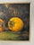 This is an original oil painting of a persimmon fruit still life, signed “MC” by the artist. The painting is medium-sized...