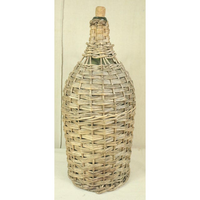 A late 19th century French wicker covered bottle. Probably used for vinegar but also for wine. Larger bottles were covered...