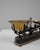 This 19th Century French iron and brass scale captures the elegance of traditional workshop craftsmanship, harmonizing...